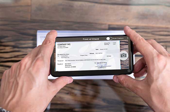 Screenshot of an online banking mobile app showing take photos of the front and back of the check.