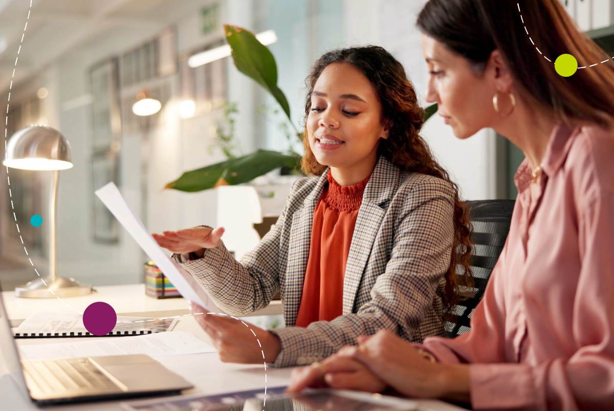 Two women working on a laptop