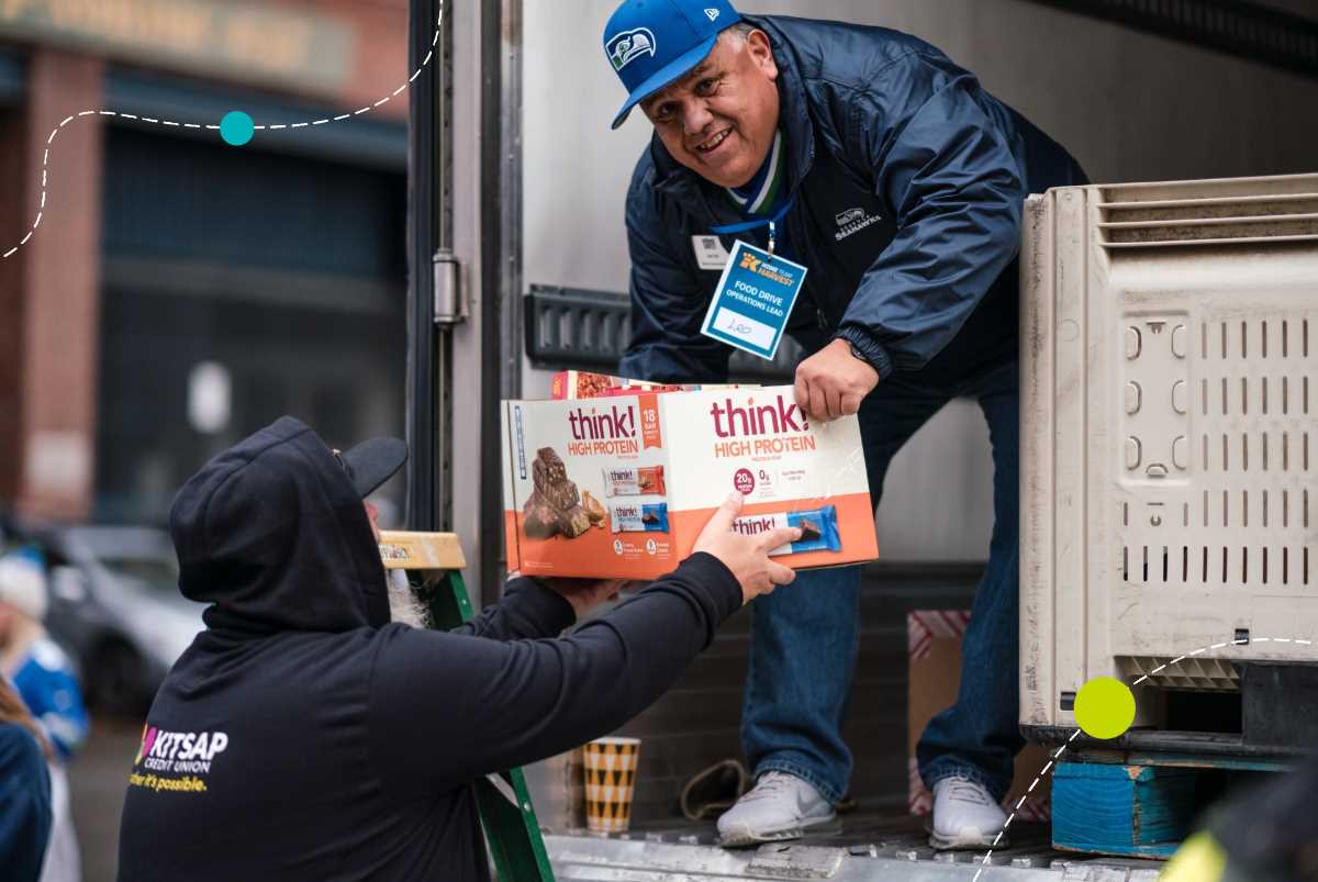 Kitsap Credit Union employee loads truck with food