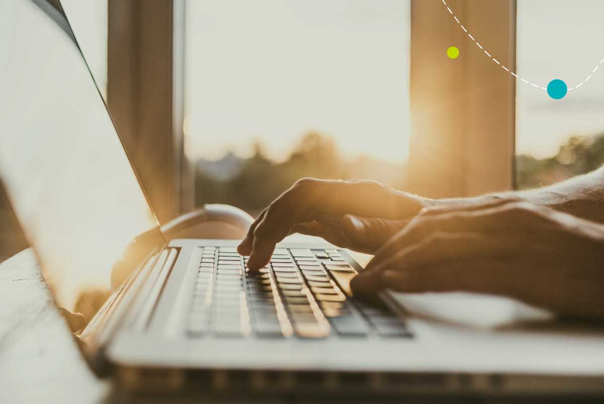 person typing on laptop